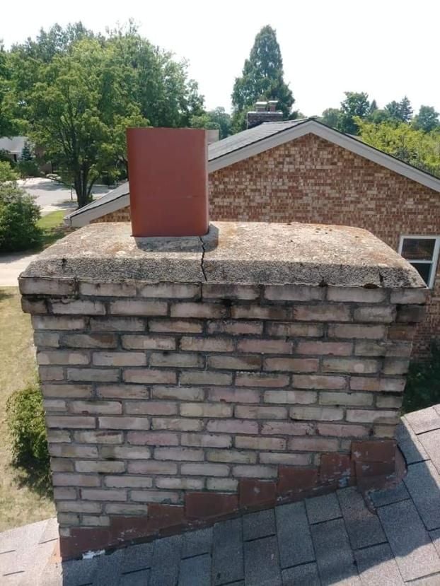 Before a completed chimney repair project in the  area